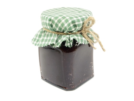 glass jar of plum jam on a white background 
    の写真素材