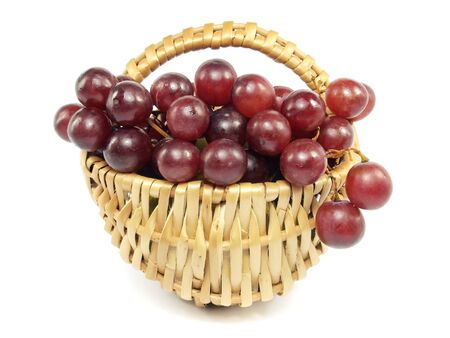 grapes in wicker basket on a white background 
  の写真素材