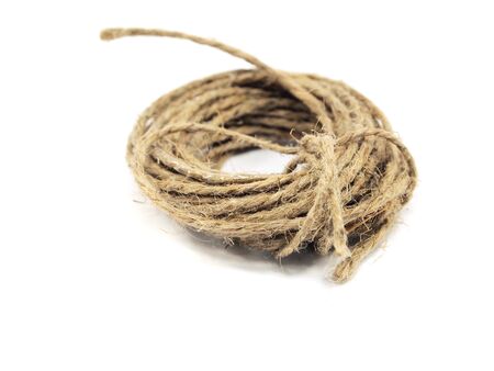 coil of old rope on a white background 