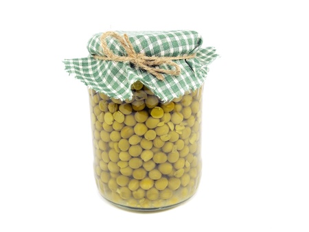 canned green peas in glass jar on a white background 
 の写真素材