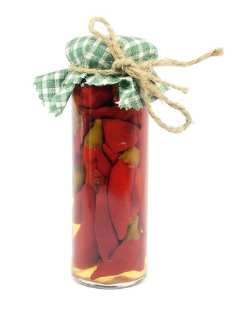Preserved red hot pepper in glass jar on a white background 
 の写真素材