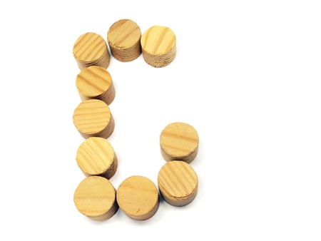 wood building blocks letter G on a white background 
  の写真素材