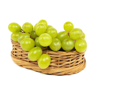 grapes in wicker basket on a white background 
    の写真素材