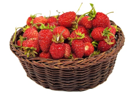 Red wild strawberry in basket on a white background 
  の写真素材