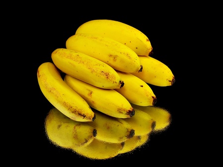 small organic bananas on a black background with water drops
     の写真素材