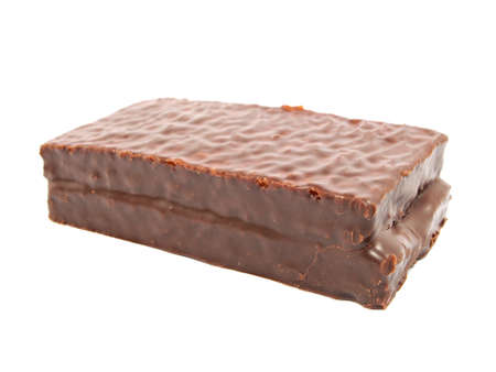 sponge cake dessert covered with chocolate on a white backgroundの写真素材