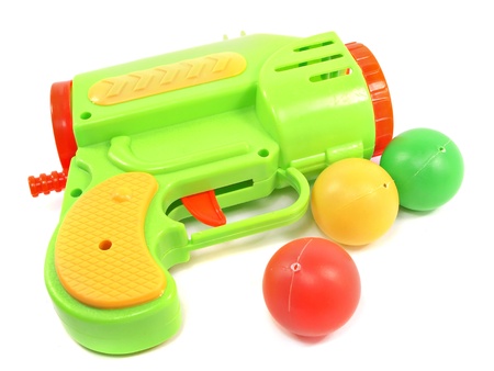 Colorful toy gun with plastic balls on white background 
の写真素材