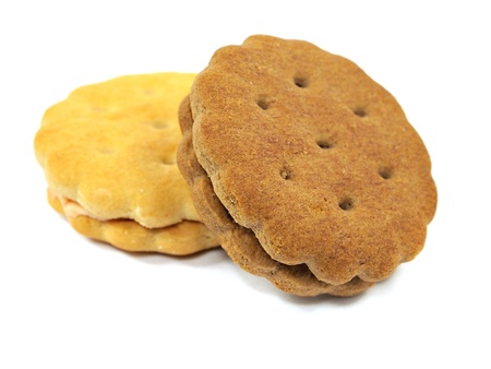 sandwich biscuits with cream and chocolate fillings on a white background 
       の写真素材