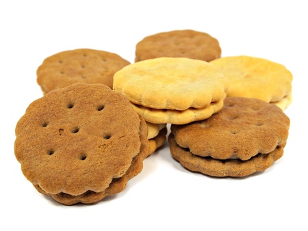 sandwich biscuits with cream and chocolate fillings on a white background 
       の写真素材