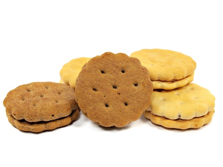 sandwich biscuits with cream and chocolate fillings on a white background 
       の写真素材