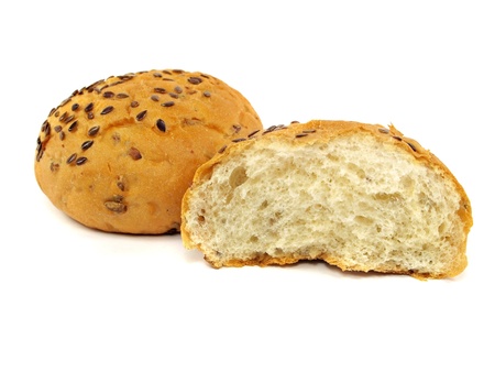 bread with flax and sunflower seeds on a white background     の写真素材