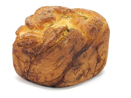 Sweet bread plait with poppy seed on a white background   の写真素材