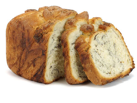 Sweet bread plait with poppy seed on a white background   の写真素材