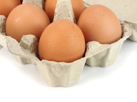 Eggs in paper box on a white background     の写真素材