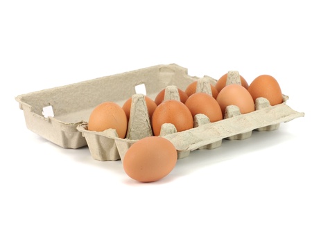 Eggs in paper box on a white background     の写真素材