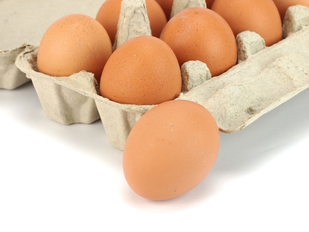 Eggs in paper box on a white background     の写真素材