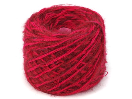 red wool ball on a white background  の写真素材