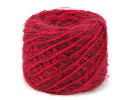 red wool ball on a white background  の写真素材