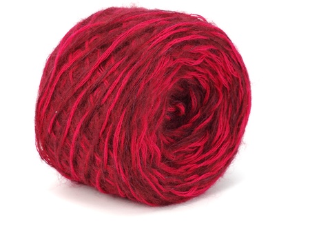 red wool ball on a white background  の写真素材