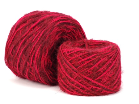 red wool ball on a white background  の写真素材