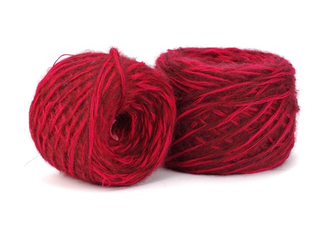 red wool ball on a white background  の写真素材