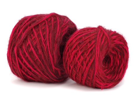 red wool ball on a white background  の写真素材