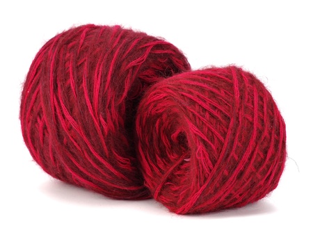 red wool ball on a white background  の写真素材