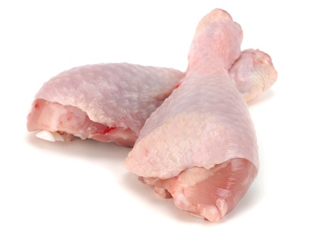 raw chicken legs on a white background       の写真素材