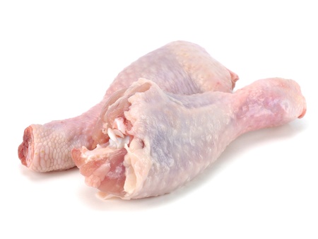 raw chicken legs on a white background       の写真素材