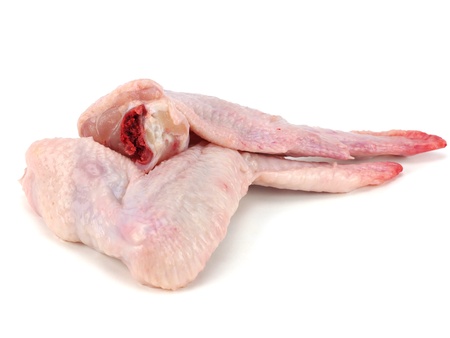 raw chicken wings on a white backgroundの写真素材