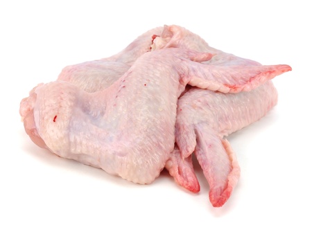 raw chicken wings on a white backgroundの写真素材