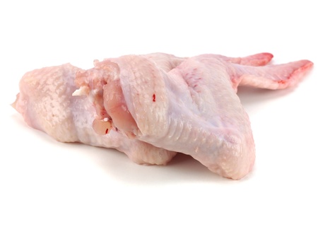 raw chicken wings on a white backgroundの写真素材
