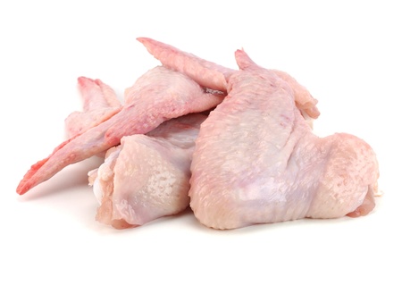 raw chicken wings on a white backgroundの写真素材