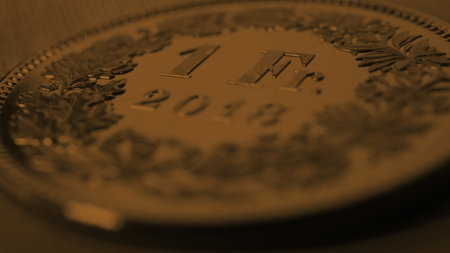 1 Swiss Franc coin closeup. Dark brown background or wallpaper on an economic, business or banking theme. Money and Central Bank in Switzerland. Macroの写真素材