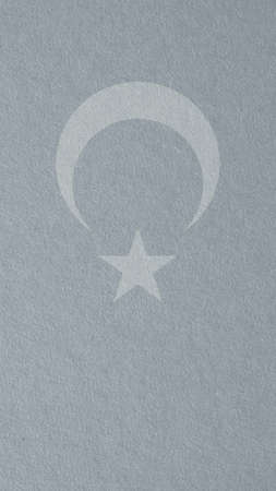 Turkey flag outline on cardboard surface. Paper texture with cellulose fibers. mobile phone wallpaper. Light silver paperboard. Gray tinted vertical backgroundの写真素材