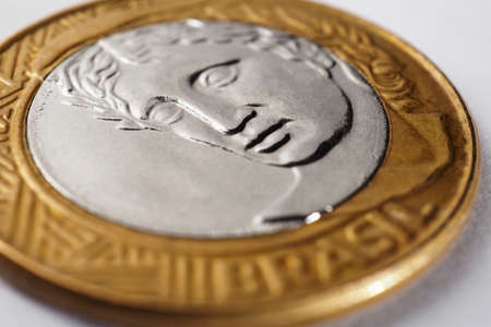 Brazilian 1 real coin close-up. Reverse of the coin with the Figure of the Republic, the national symbol of Brazil. Illustration about money, finance, currency and economy. Macroの写真素材