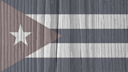 Cuban flag on a dry wooden surface. Natural wallpaper or background made of old wood. Symbol of Cuba. Discolored look close to black and whiteの写真素材