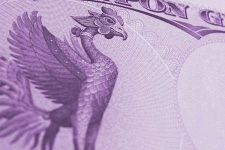 Fragment of 10,000 yen Japanese bill. Background with Phoenix bird and copy space to its right. Purple tinted backdrop about money, banking and the economy of Japan. Macroの写真素材