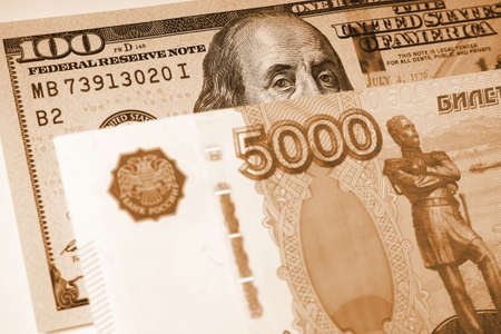 Fragments of Russian and American paper money. ruble and dollar. Banknote of 5000 rubles and note of...