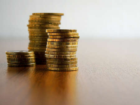 Piles of coins are on the table. close-upの写真素材