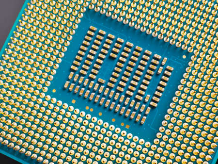 Processor microprocessor of a computer or laptop lies on a dark matte surface. close-up. Electronic...