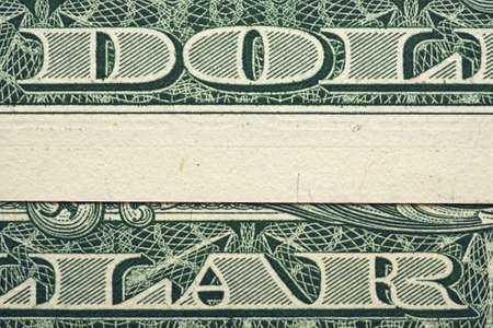 The inscription "dollar" in large letters. one dollar bill collageの写真素材