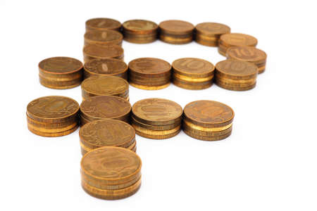 The sign of the Russian ruble, laid out in stacks of coins of 10 rubles. The background is white, not isolated. News about the state budget, the central bank and the refinancing rate. Macroの写真素材