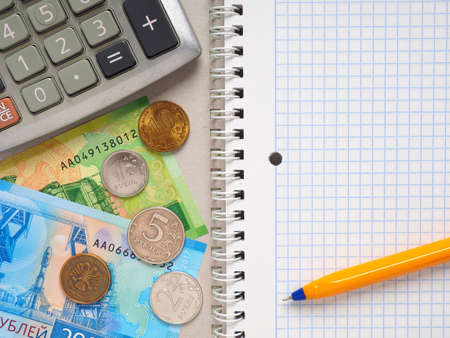 Composition of items for counting income and expenses. Notepad, calculator, pen and Russian moneyの写真素材