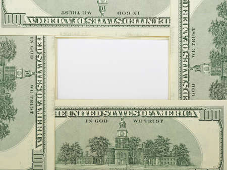 American dollars with place for text. Banknotes of $100 on the reverse are laid out in a circle and form a copy-space. White paper surface in the center. American economy and national currency. Macroの写真素材