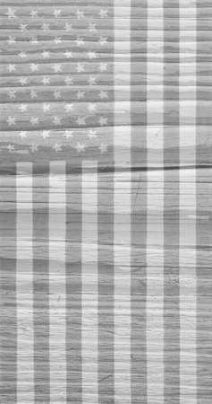 Hand-drawn US national flag on old wooden surface. Light mobile phone wallpaper. Vertical patriotic background or backdrop, that looks like a black and white photo. american independence dayの写真素材