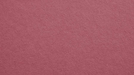 The surface of dark red cardboard. Puce paperboard wallpaper. Paper texture with cellulose fibers. Purple-brown tinted background. Beautiful textured backdrop. top-down. Macroの写真素材