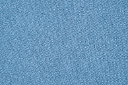 Light blue woven surface close-up. line textile texture. fabric background. Textured braided backdrop or wallpaper. Macroの写真素材