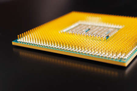 Processor microprocessor CPU of a desktop or laptop lies on dark matte surface. close-up....