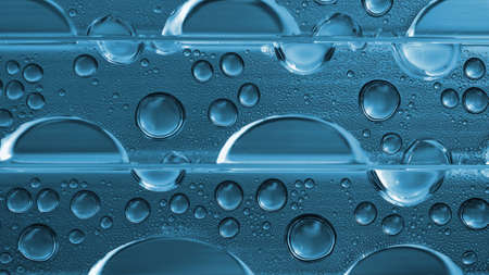 water drops closeup. abstract aqua wallpaper. Blue tinted natural background. Strong macro